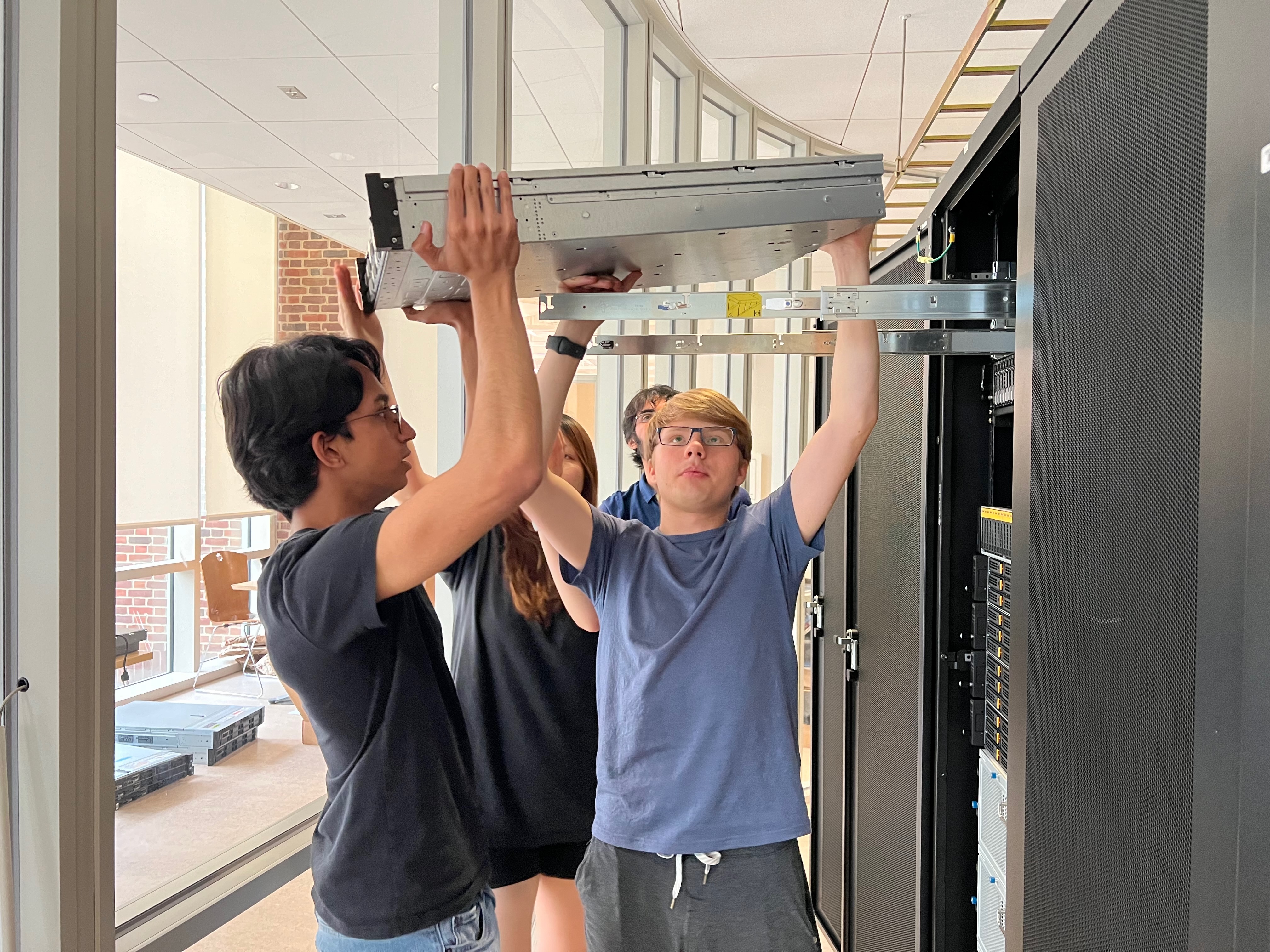 Infrastructure Division members installing a server